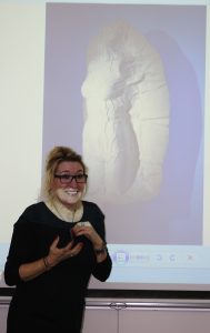 a teacher presenting art
