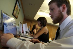 a male and female student using computers