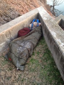 sleeping bag on ground with frost on top