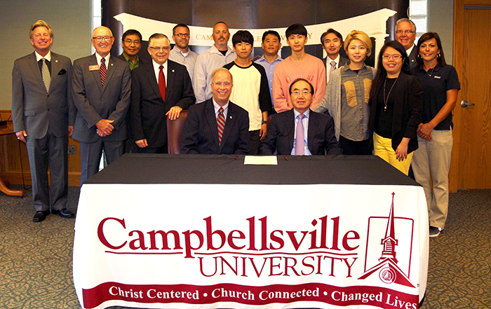 group of students and people at a table