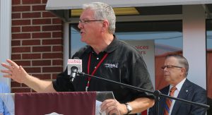 man speaking at podium