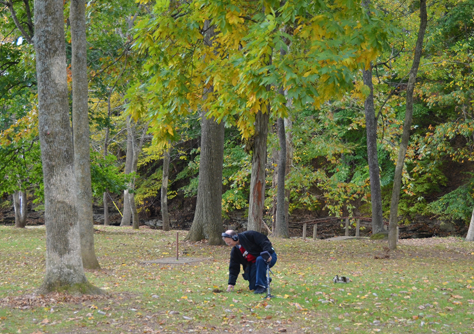 man digging into ground